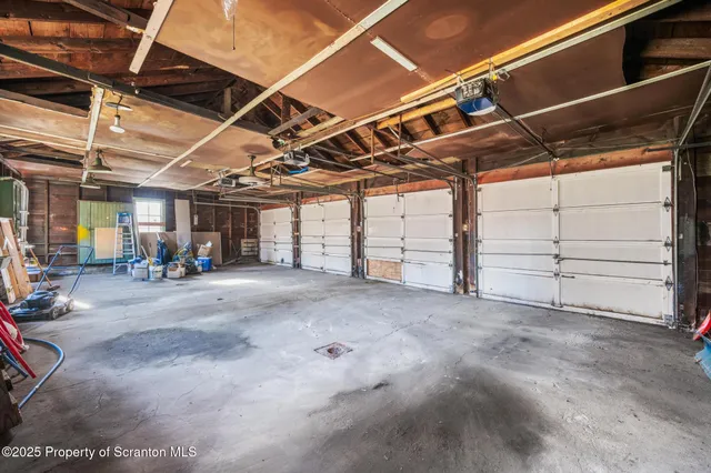 a view of empty room with wooden ceiling