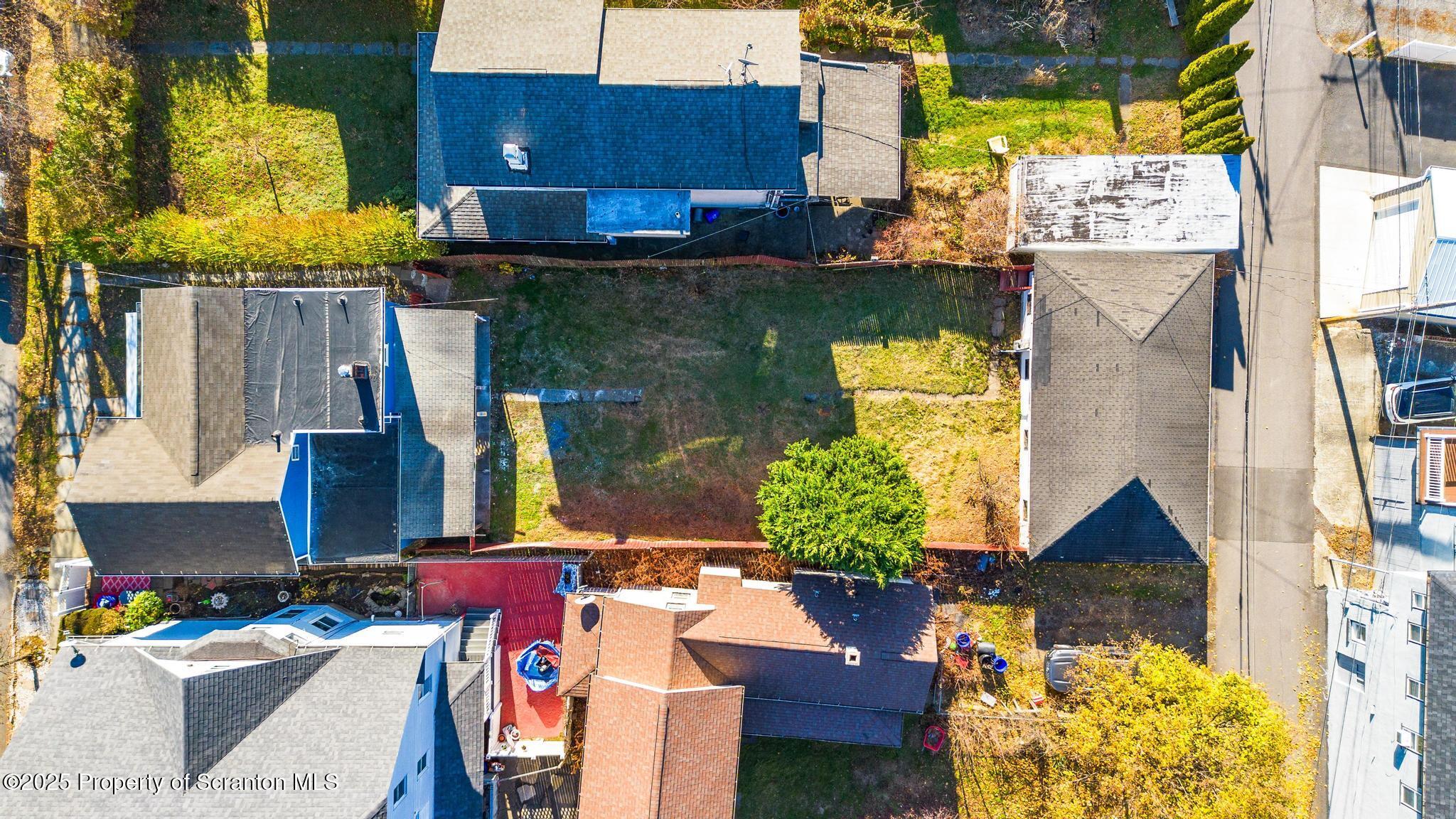 949 Taylor Avenue Scranton, PA 18510 - Photo 8 of 46 a aerial view of a house with swimming pool and large trees