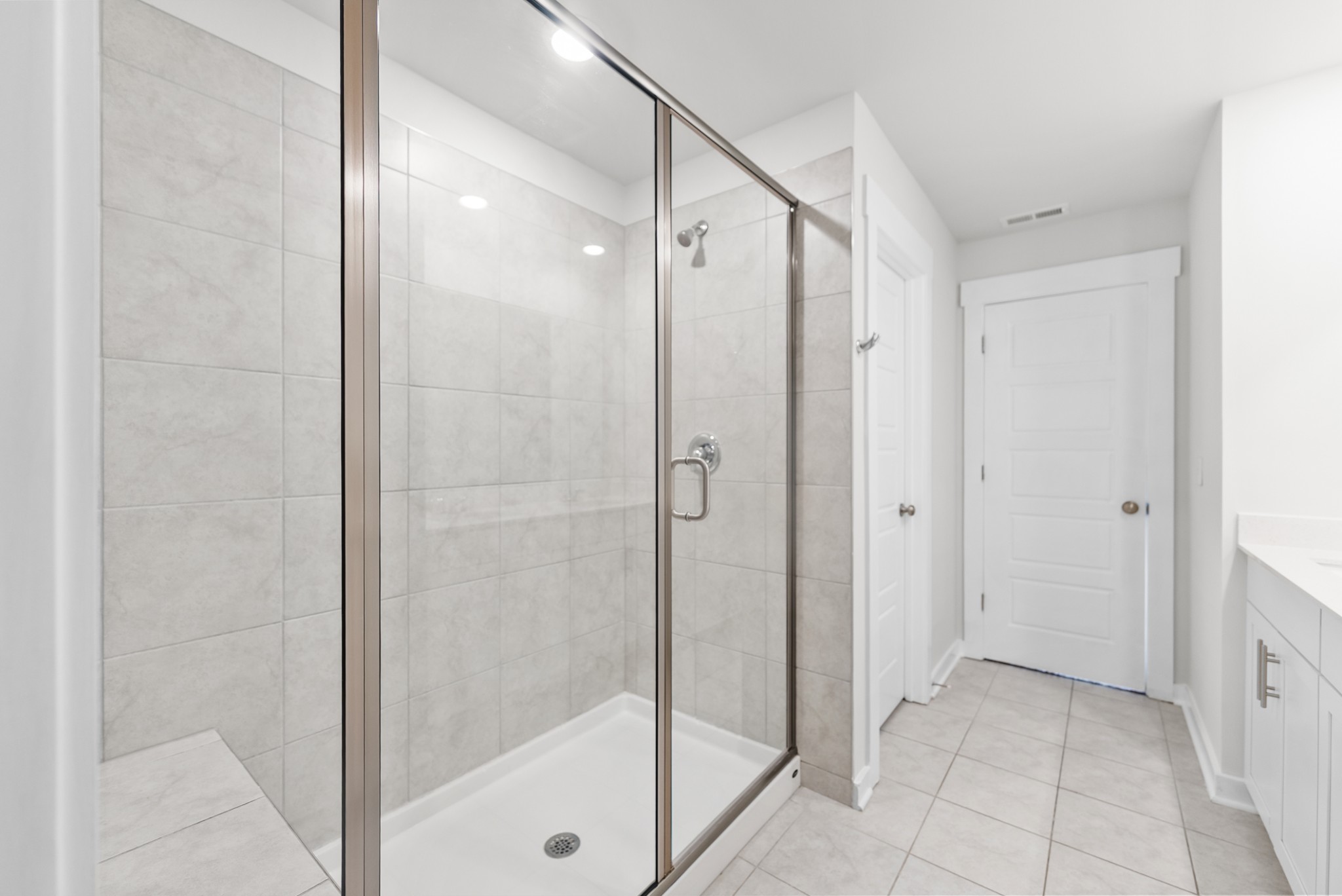 1255 Inverness Pass Lebanon, TN 37087 - Photo 29 of 40 a bathroom with a shower and a glass door