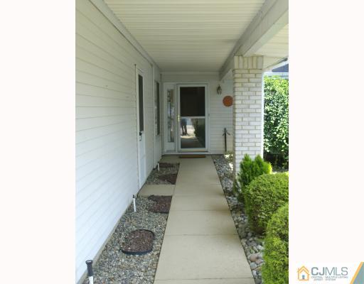 781 Risley Road Monroe Township, NJ 08831 - Photo 2 of 10 a view of a backyard with potted plants