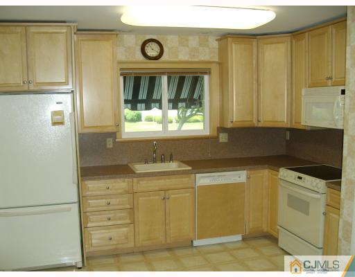 781 Risley Road Monroe Township, NJ 08831 - Photo 3 of 10 a kitchen with a cabinets and window