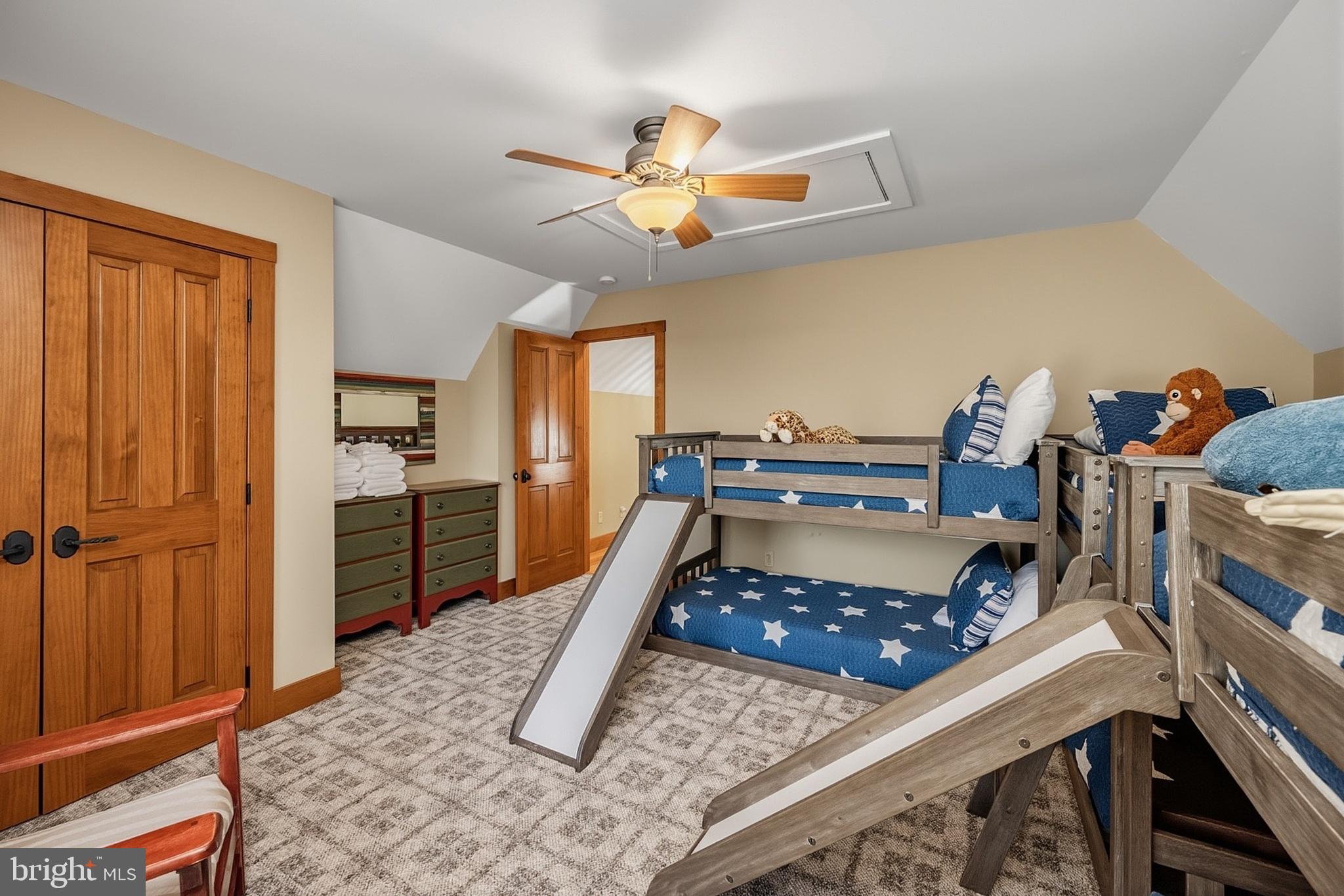 185 Ruta Lane Swanton, MD 21561 - Photo 64 of 81 a bedroom with a bed and a chandelier
