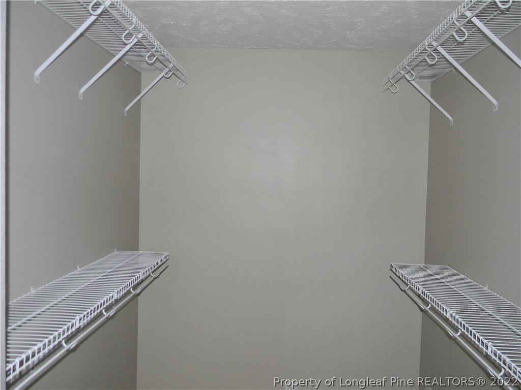 122 Middle Court Raeford, NC 28376 - Photo 13 of 23 a view of a room with racks on the wall