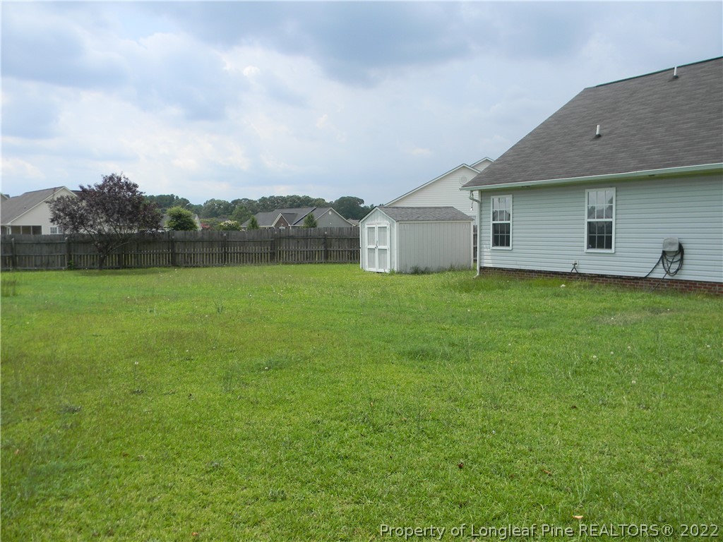 122 Middle Court Raeford, NC 28376 - Photo 18 of 23 a view of a house with a yard