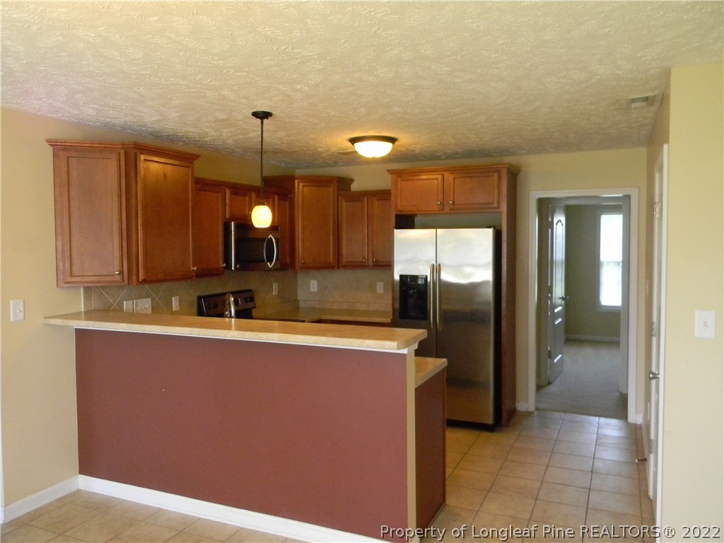 122 Middle Court Raeford, NC 28376 - Photo 5 of 23 a view of a kitchen counter top space