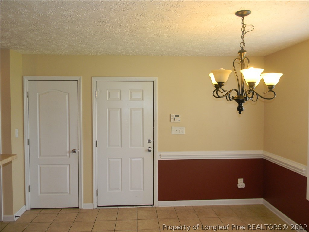 122 Middle Court Raeford, NC 28376 - Photo 6 of 23 a view of a room with wooden floor and staircase
