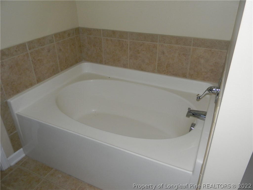 122 Middle Court Raeford, NC 28376 - Photo 10 of 23 a close up of a bathtub