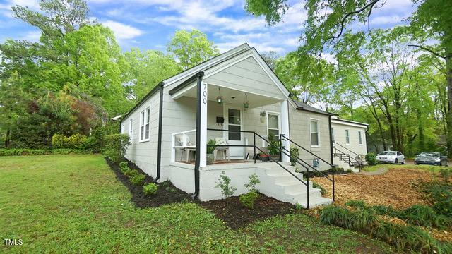 700 Glascock Street Raleigh, NC 27604 - Photo 1 of 21 a view of an house with backyard space and garden