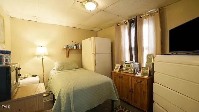 a room with bed and flat screen tv