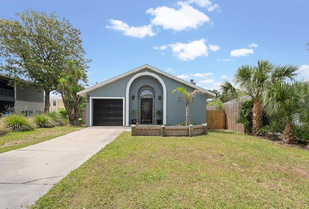 207 B Street St. Augustine Beach, FL 32080 - Photo 1 of 22 a view of a house with a yard