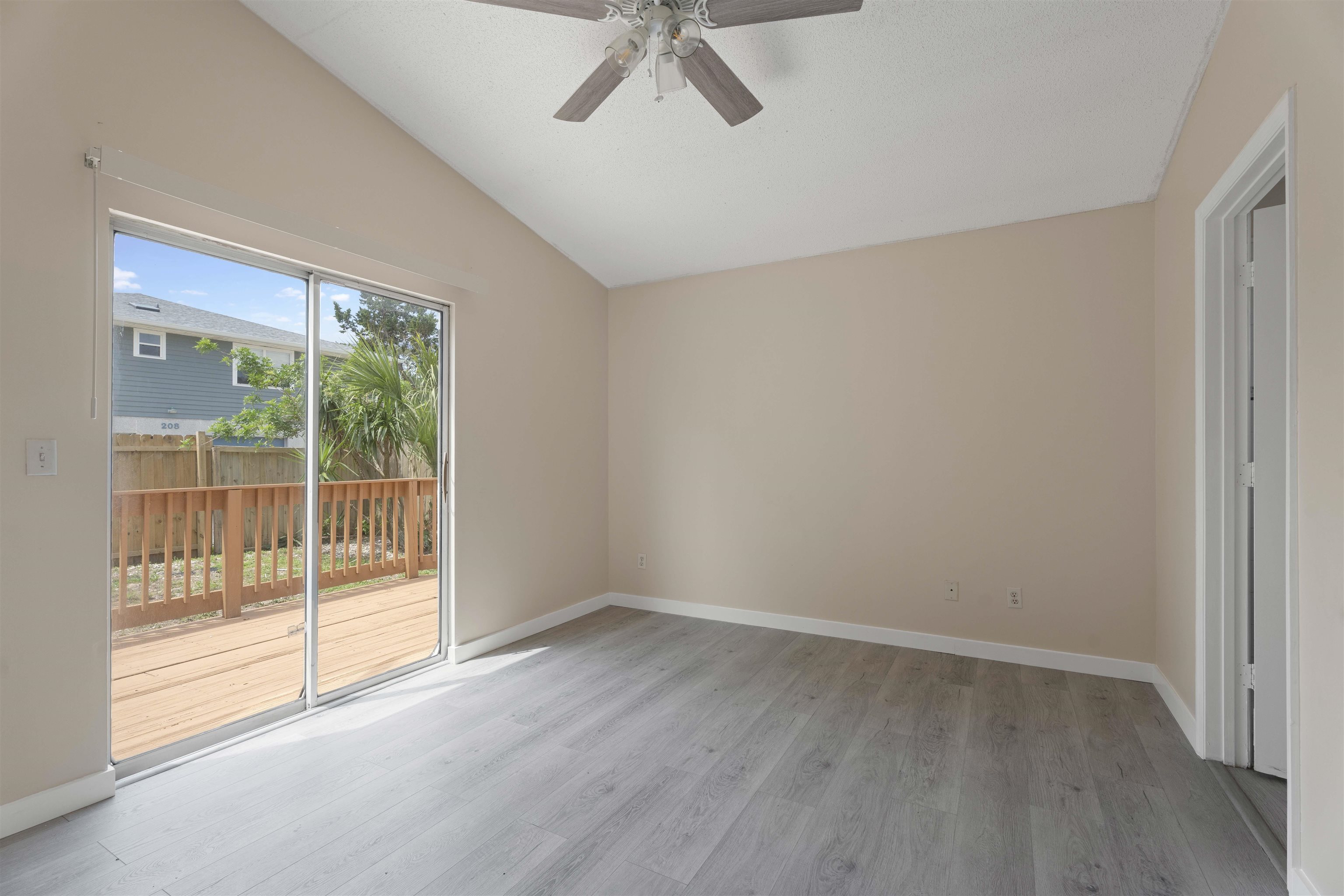 207 B Street St. Augustine Beach, FL 32080 - Photo 11 of 22 a view of an empty room with a window