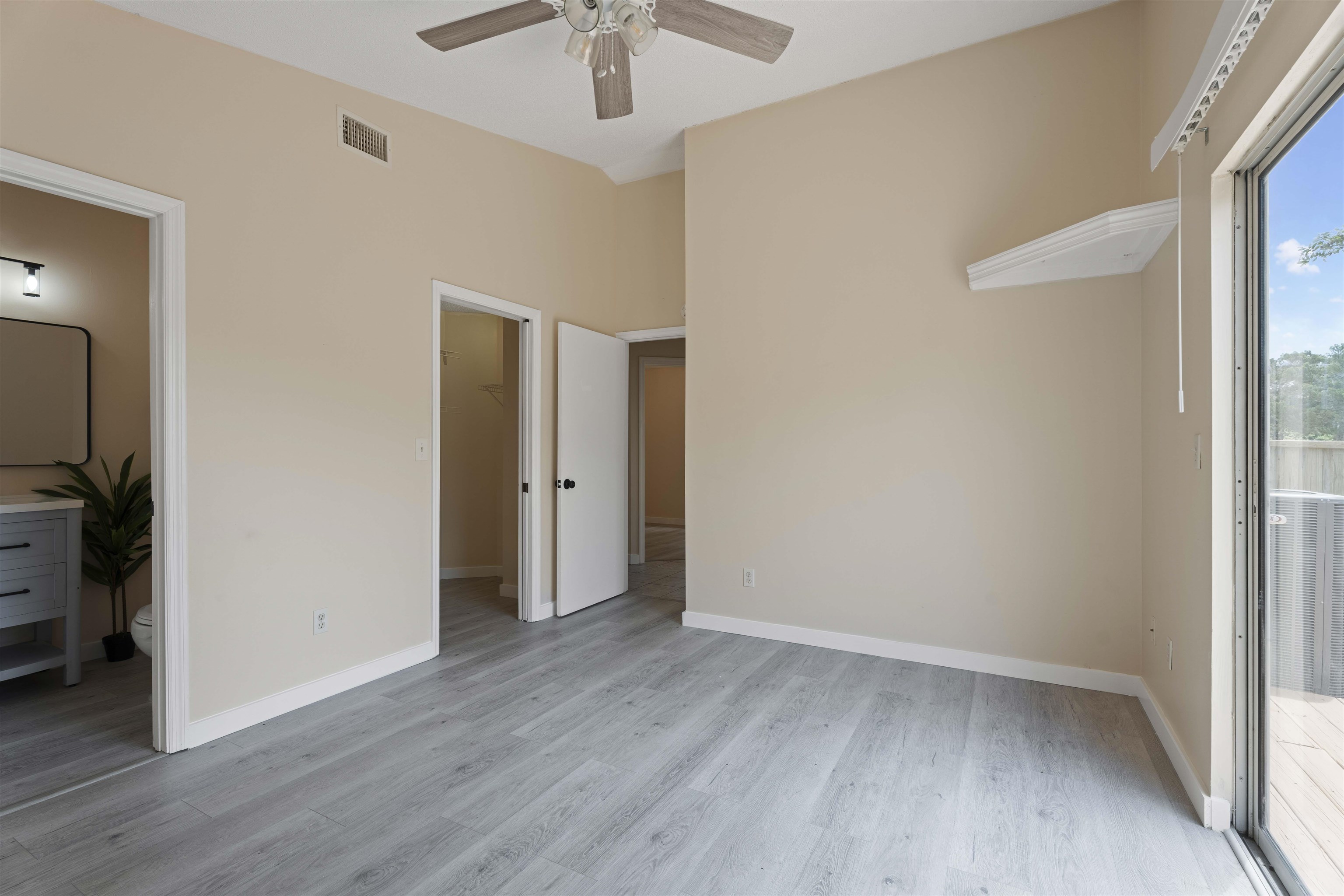 207 B Street St. Augustine Beach, FL 32080 - Photo 12 of 22 wooden floor in an empty room with a window