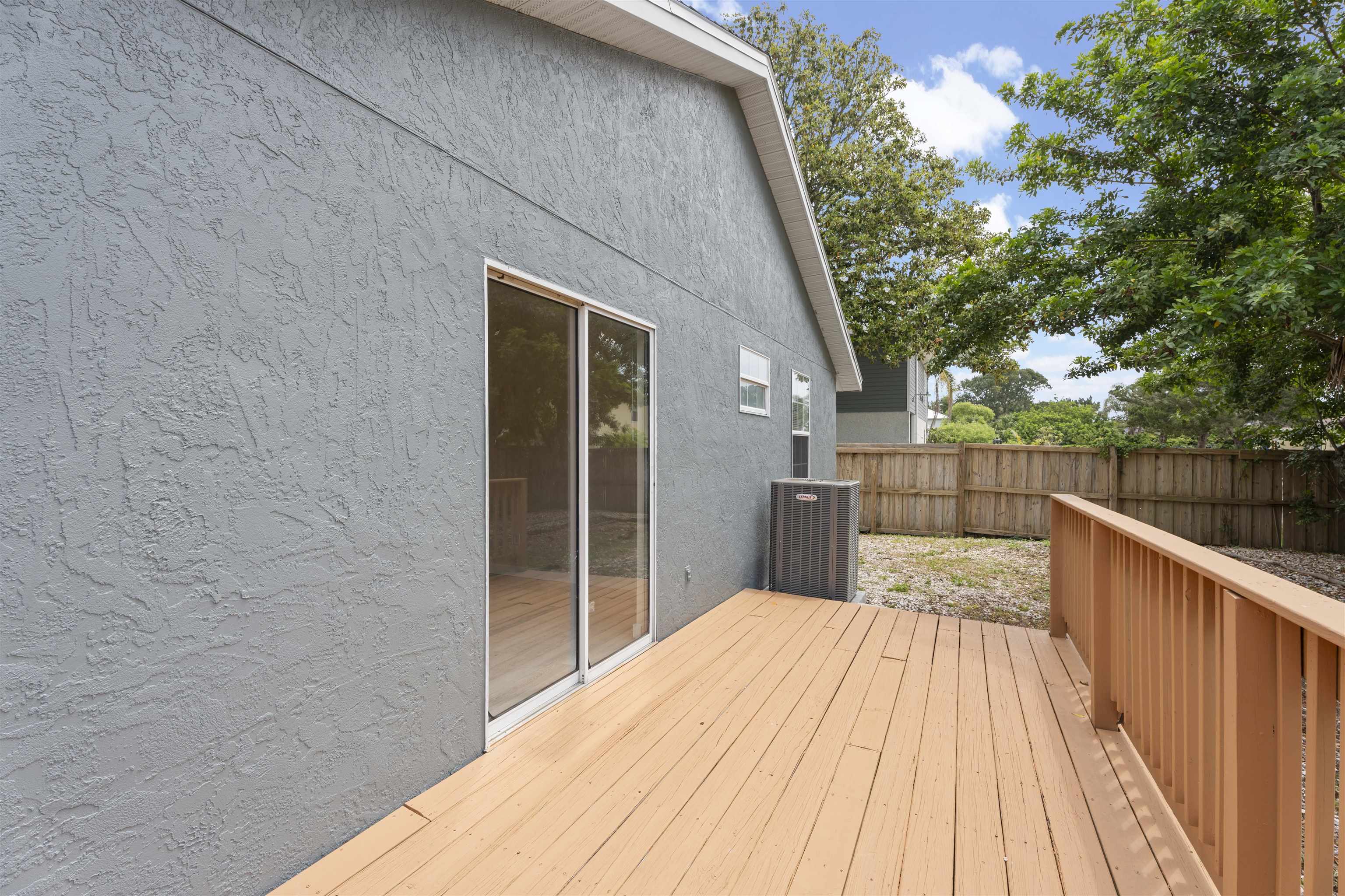 207 B Street St. Augustine Beach, FL 32080 - Photo 15 of 22 a view of wooden deck and a garden