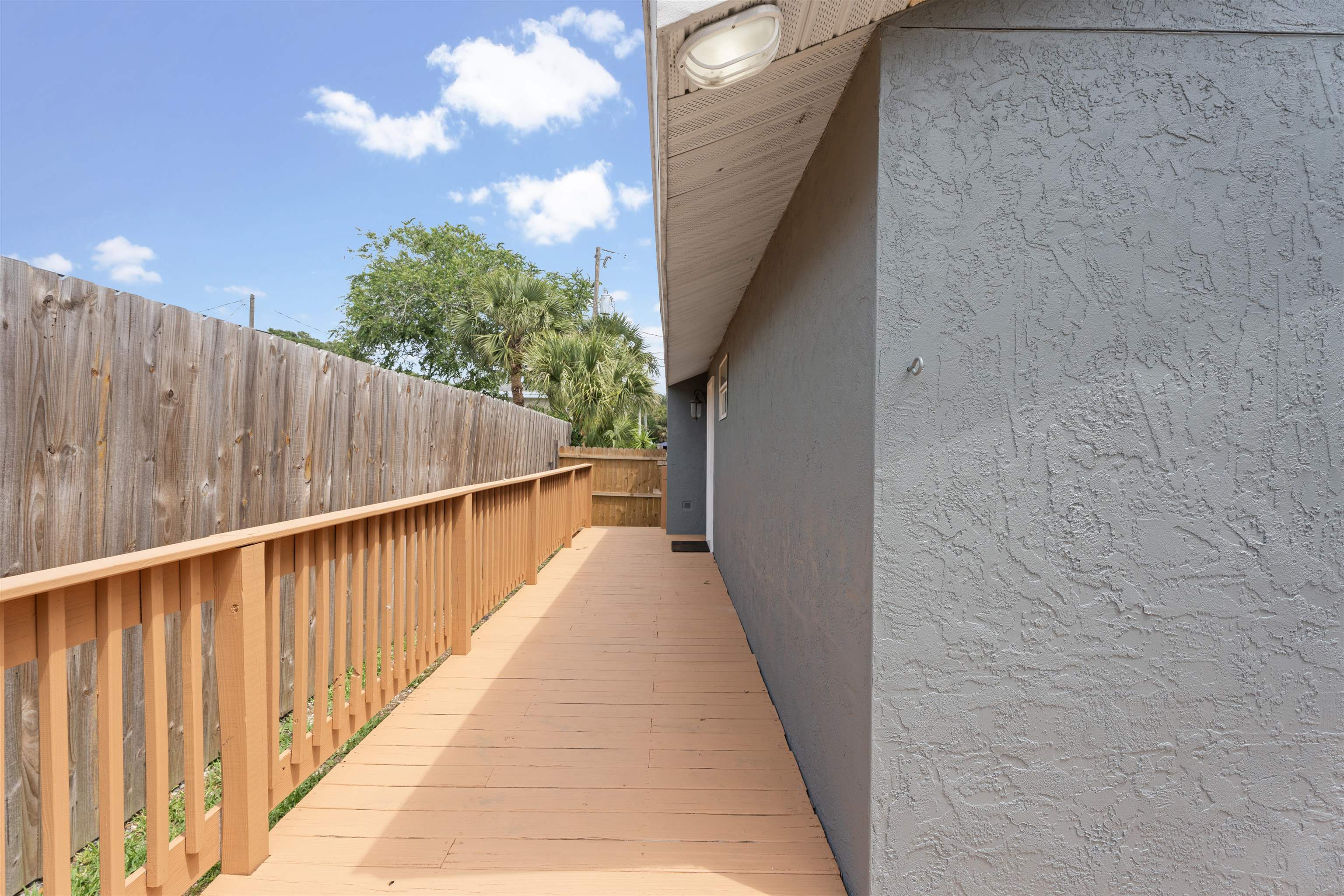 207 B Street St. Augustine Beach, FL 32080 - Photo 16 of 22 a view of balcony with wooden floor and stairs