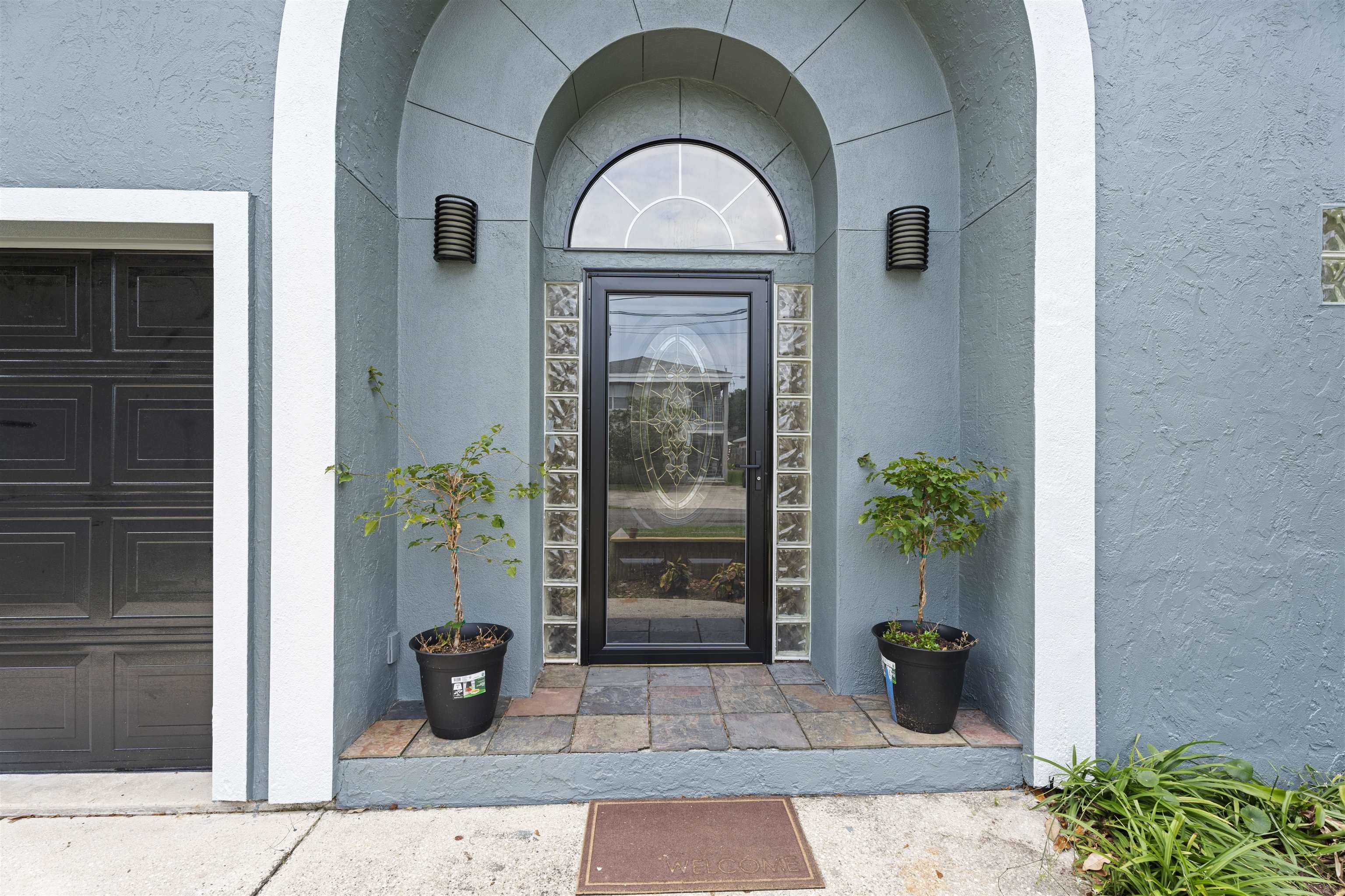 207 B Street St. Augustine Beach, FL 32080 - Photo 2 of 22 a view of a entryway door front of house