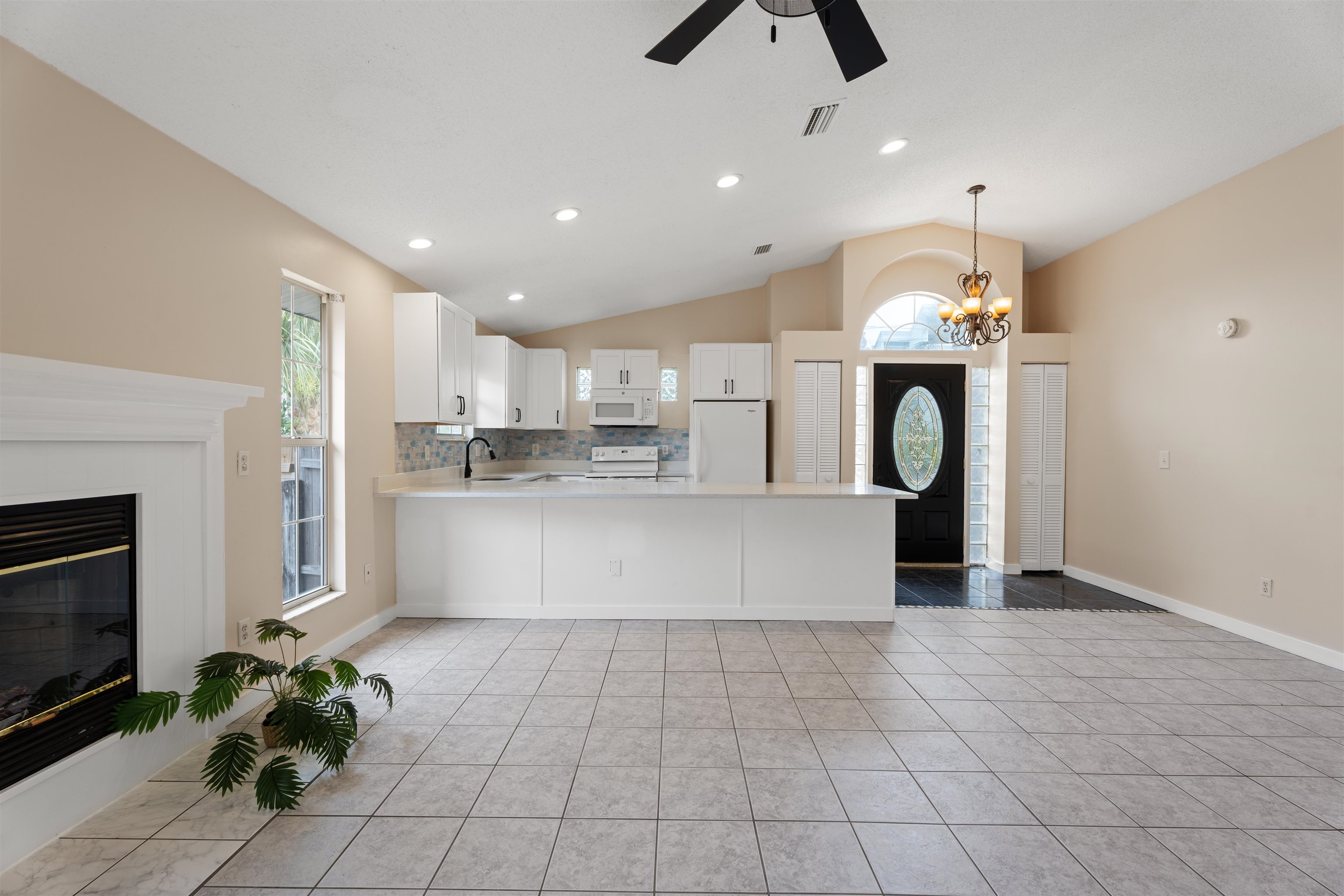 207 B Street St. Augustine Beach, FL 32080 - Photo 6 of 22 a view of kitchen with cabinets and window