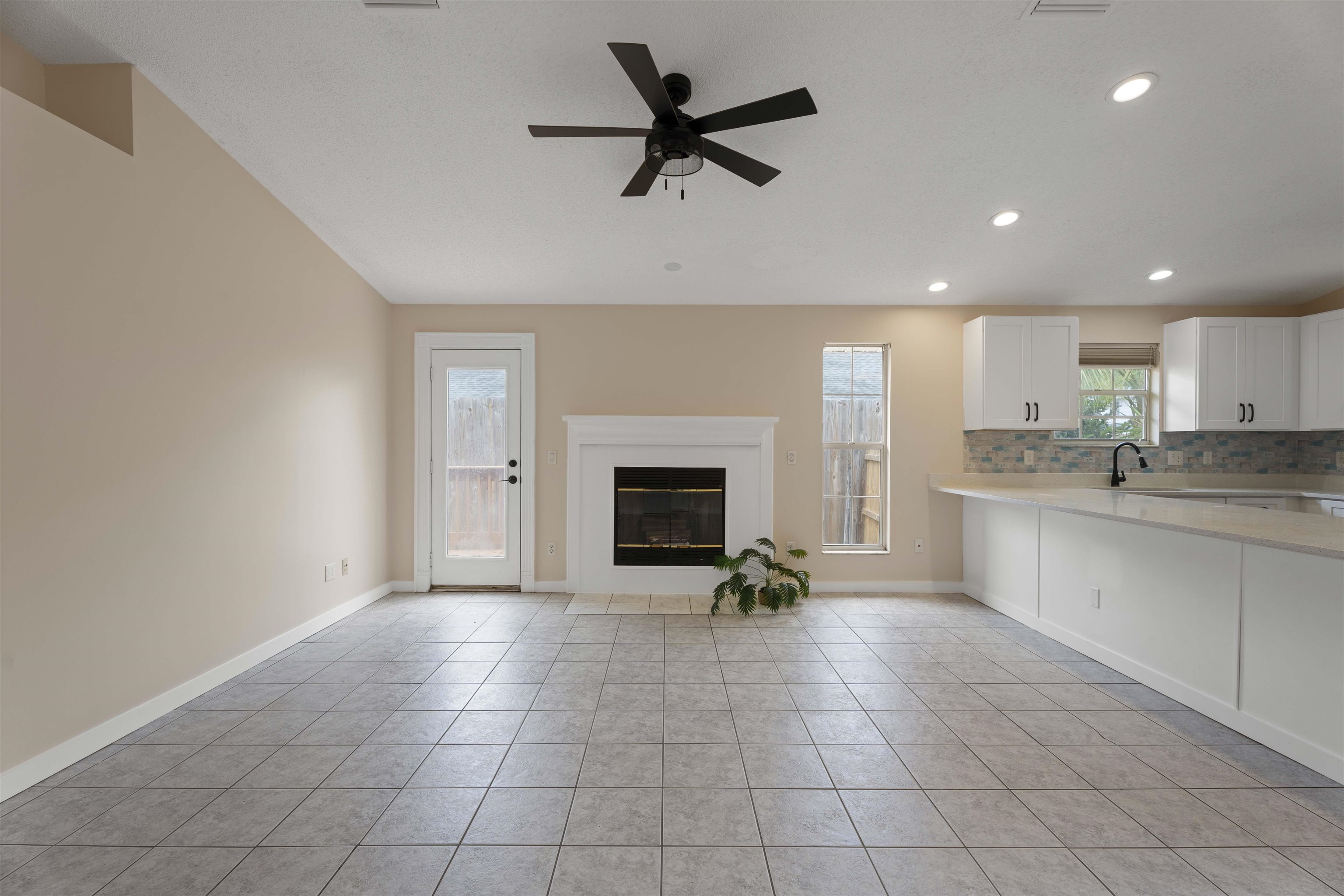 207 B Street St. Augustine Beach, FL 32080 - Photo 7 of 22 a open kitchen with cabinets and a fireplace