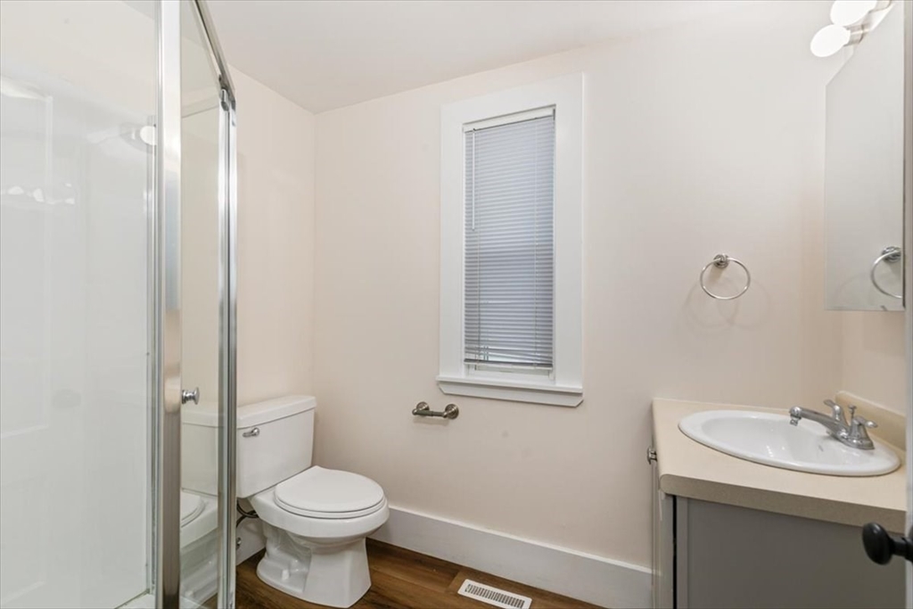 16 Rantoul Street Beverly, MA 01915 - Photo 13 of 34 a bathroom with a sink a toilet and a mirror