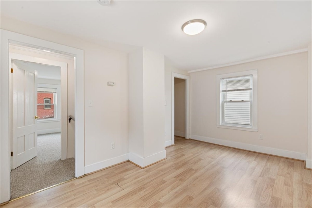16 Rantoul Street Beverly, MA 01915 - Photo 15 of 34 an empty room with wooden floor and windows