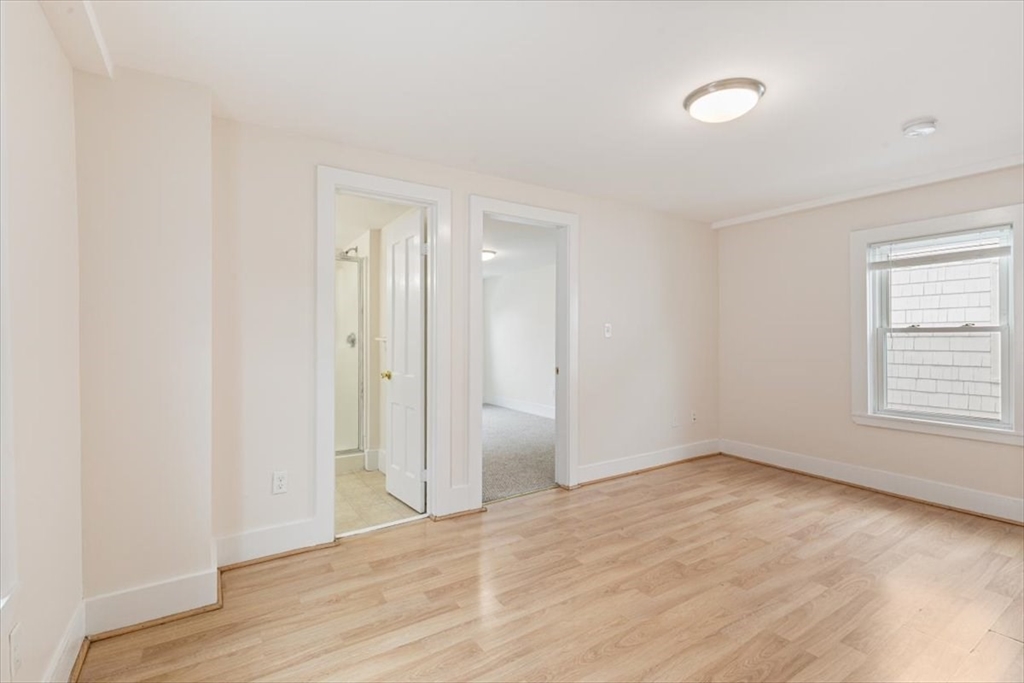 16 Rantoul Street Beverly, MA 01915 - Photo 16 of 34 an empty room with wooden floor and windows