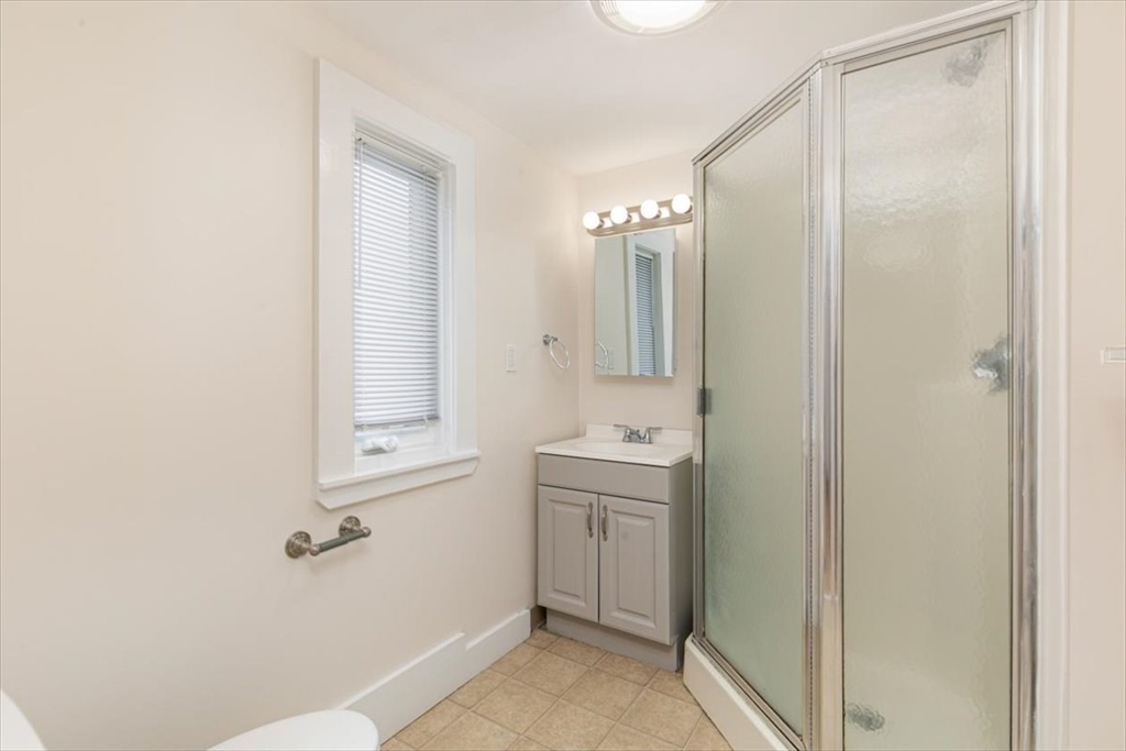 16 Rantoul Street Beverly, MA 01915 - Photo 17 of 34 a bathroom with a sink a toilet and shower