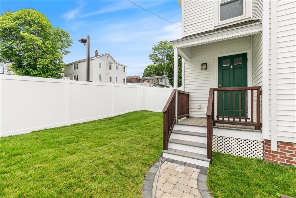 16 Rantoul Street Beverly, MA 01915 - Photo 26 of 34 a front view of a house with a garden