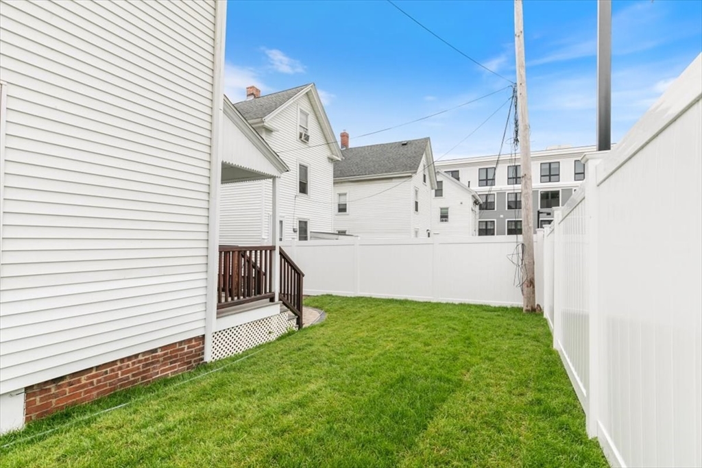 16 Rantoul Street Beverly, MA 01915 - Photo 28 of 34 a view of a small house with backyard