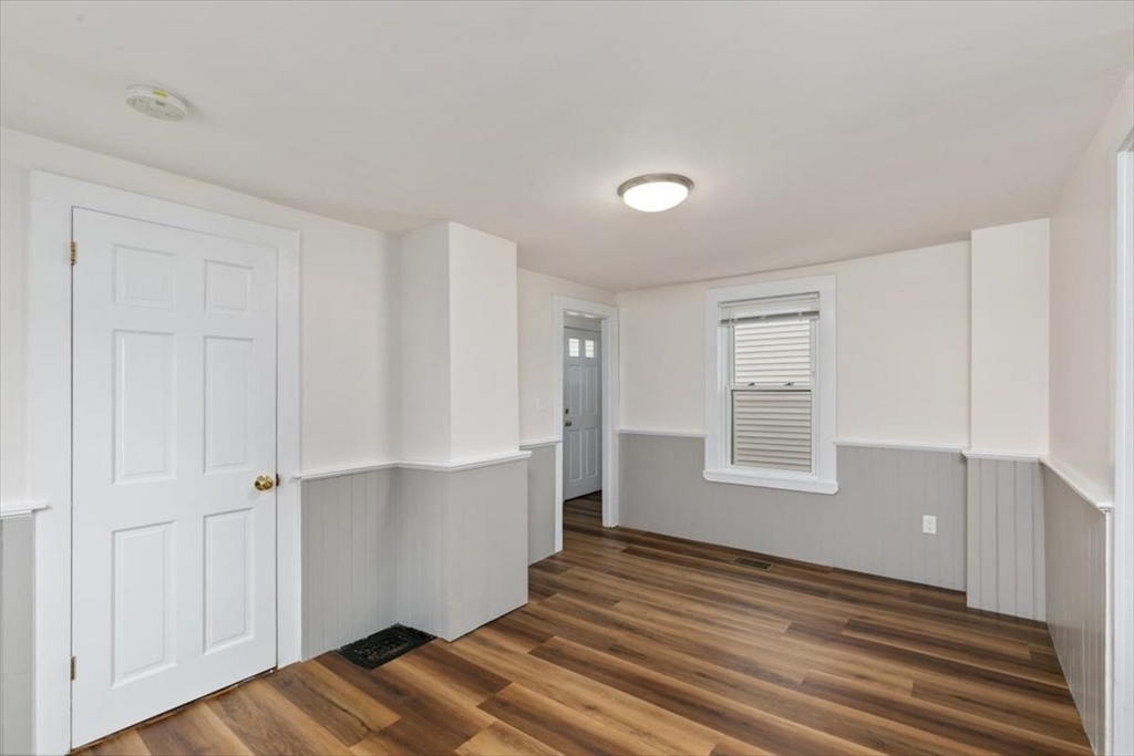 16 Rantoul Street Beverly, MA 01915 - Photo 9 of 34 an empty room with wooden floor and windows