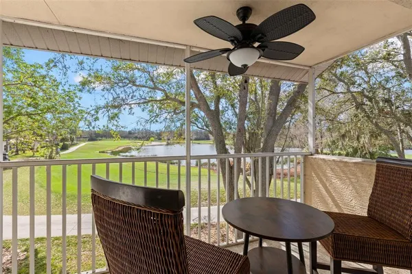 a view of a chairs and table in a balcony