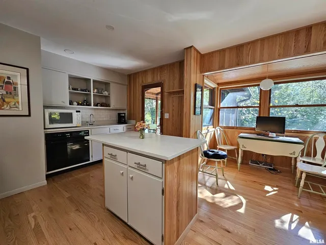 a kitchen with a stove a sink and a refrigerator