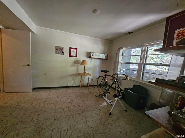 a view of a livingroom with furniture and a window