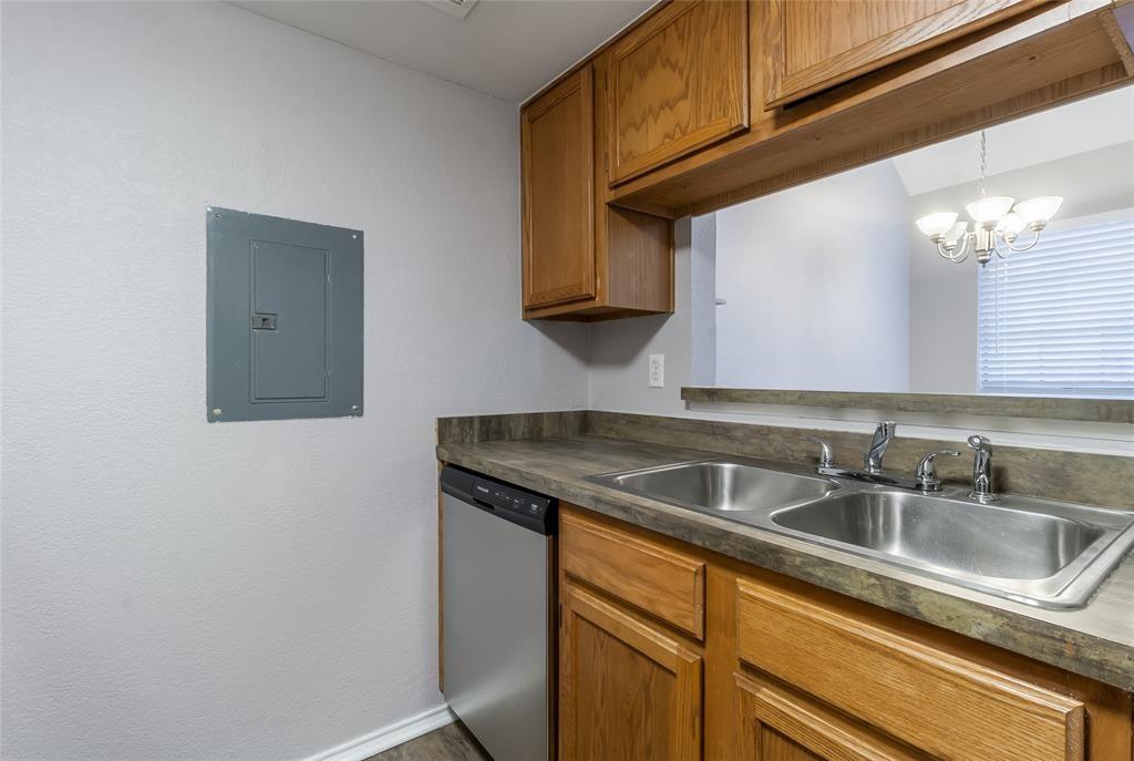 449 Harris Street, Unit 103C Coppell, TX 75019 - Photo 5 of 17 Kitchen featuring dishwasher and open bar