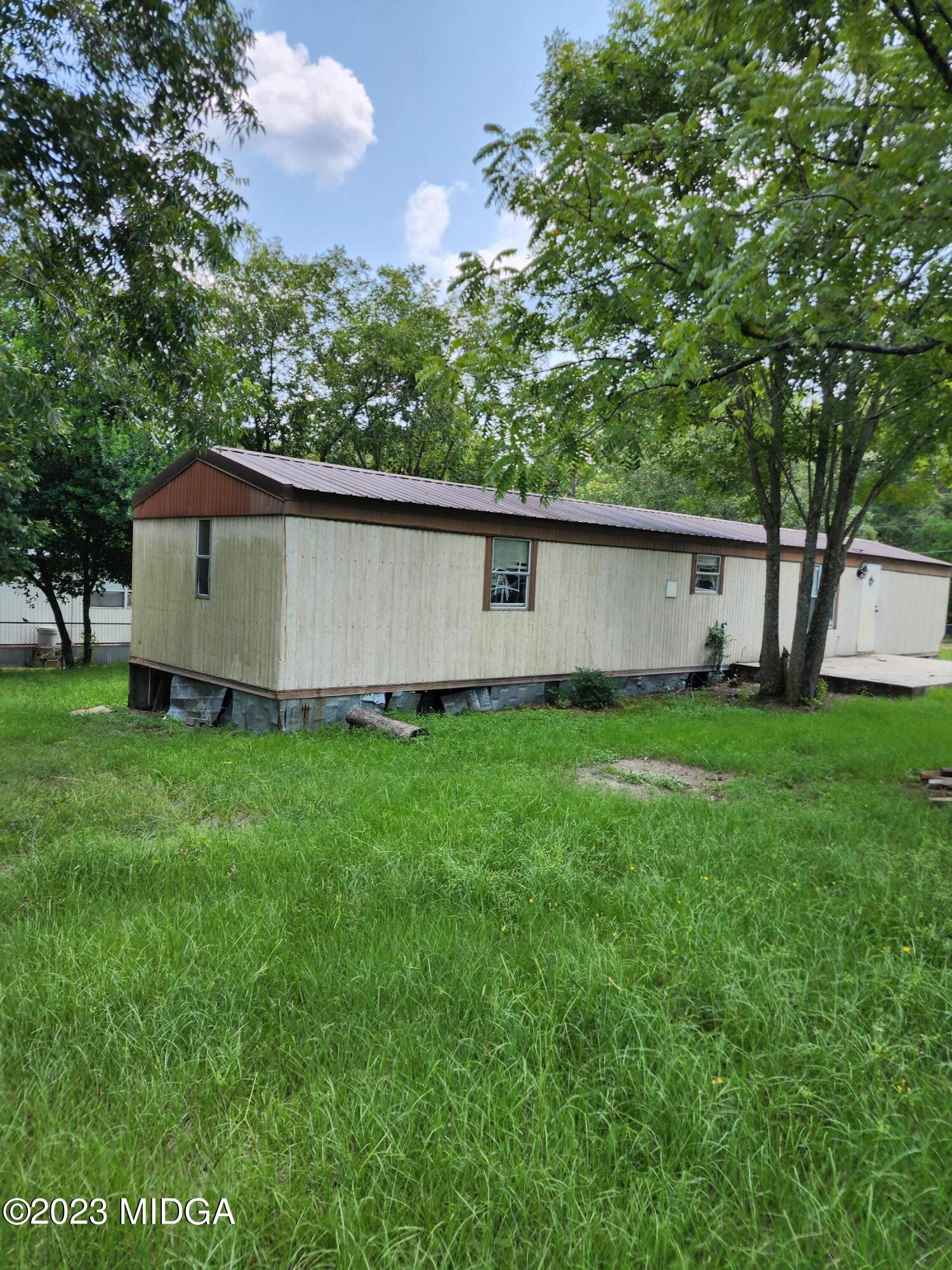 3531 Baker Road Macon, GA 31211 - Photo 11 of 21 a view of a back yard of the house with green space