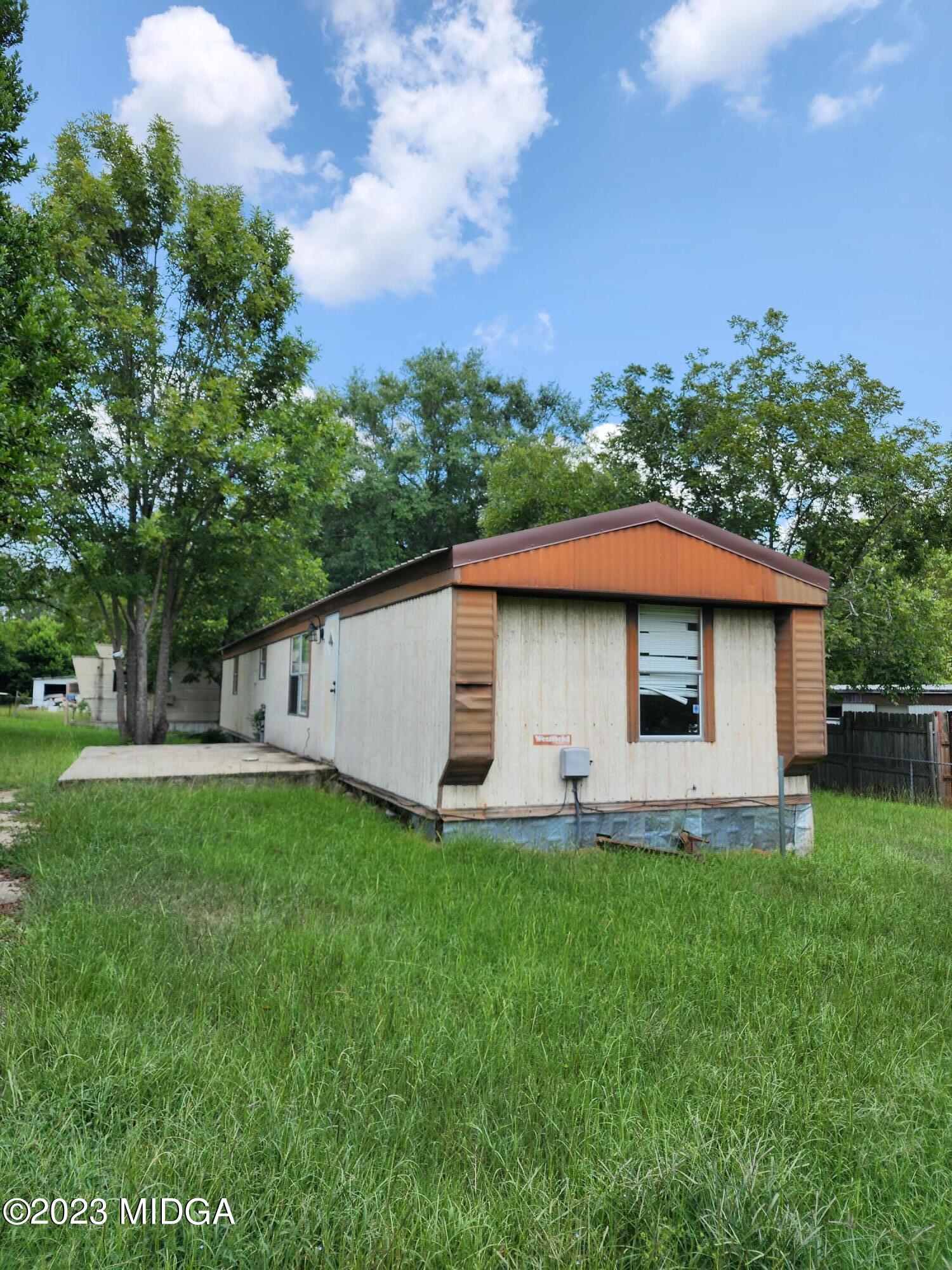 3531 Baker Road Macon, GA 31211 - Photo 3 of 21 a backyard of a house with table and chairs
