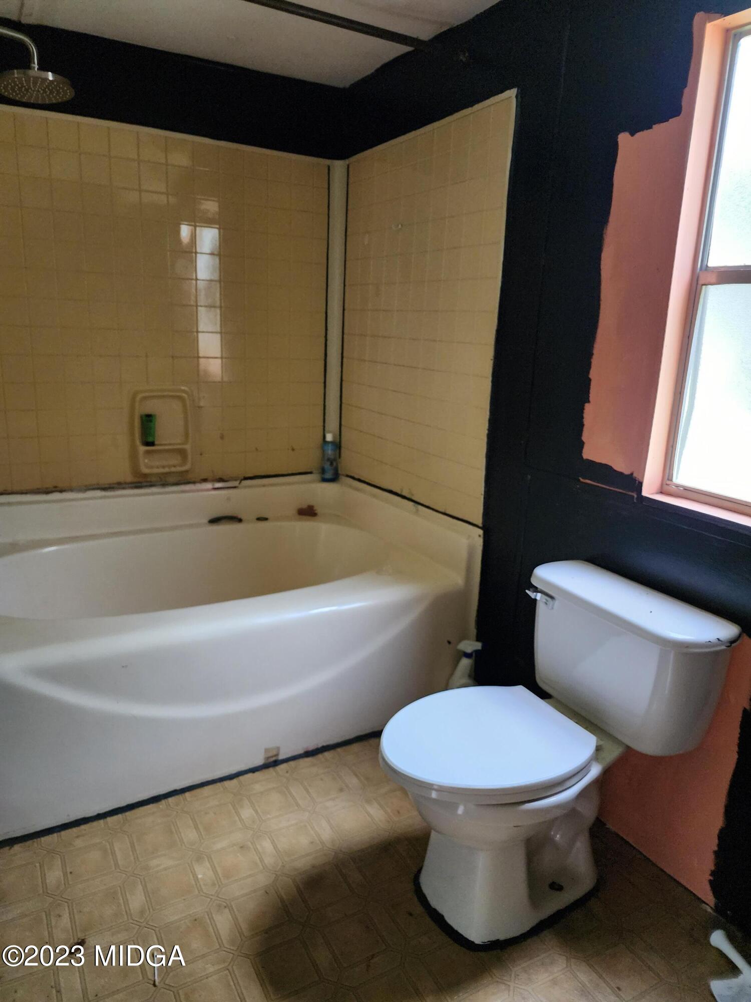 3531 Baker Road Macon, GA 31211 - Photo 10 of 21 a bathroom with a toilet and a shower