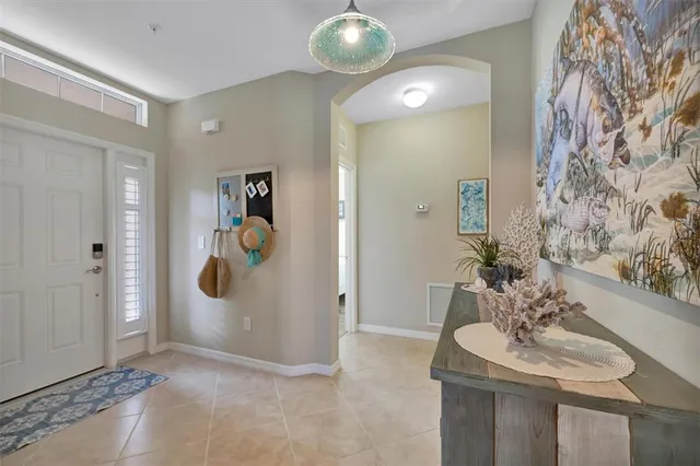 an aerial view of lake and residential houses with outdoor space