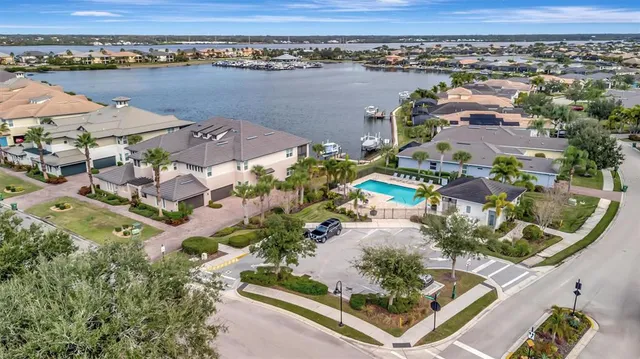 a view of a hallway to a livingroom with furniture