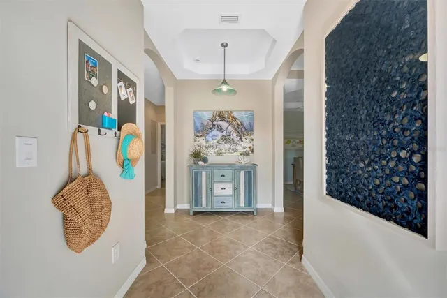 a view of a dining room with furniture and a clock