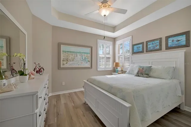 a kitchen with a stove a refrigerator a sink a center island and chairs