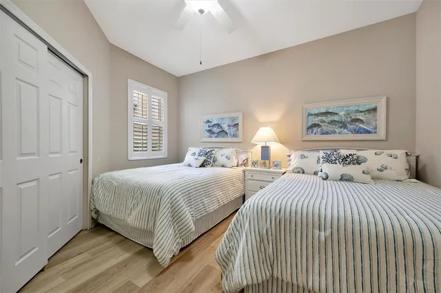 a kitchen with granite countertop white cabinets and black appliances