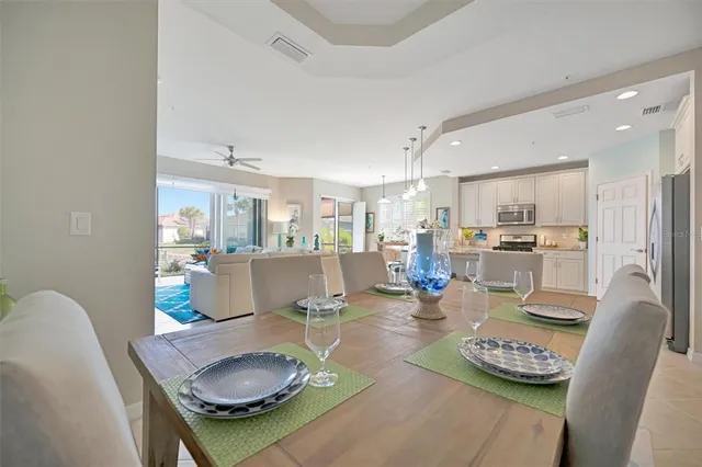 a kitchen with refrigerator and cabinets