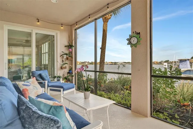 a front view of a house with swimming pool and porch