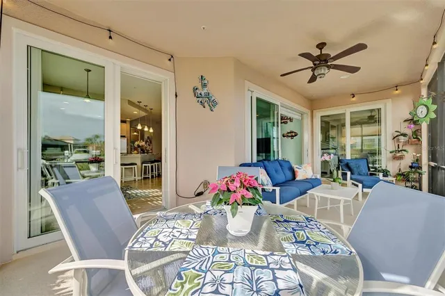 an aerial view of a house with swimming pool patio and outdoor seating