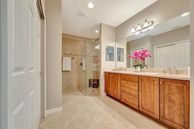 a sign board with a house in the background