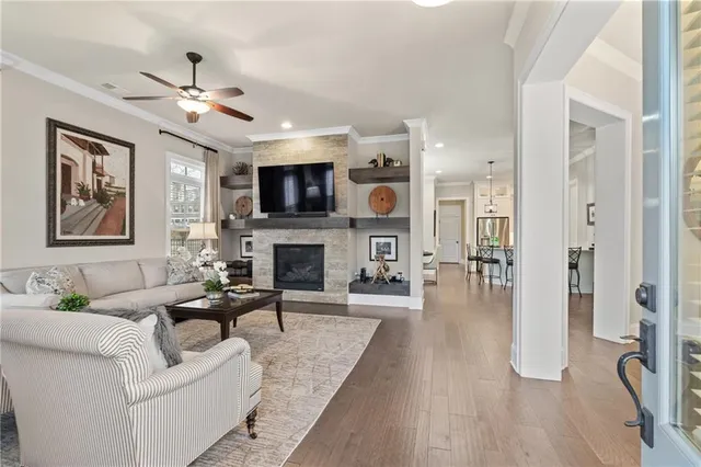 a living room with furniture fireplace and a flat screen tv
