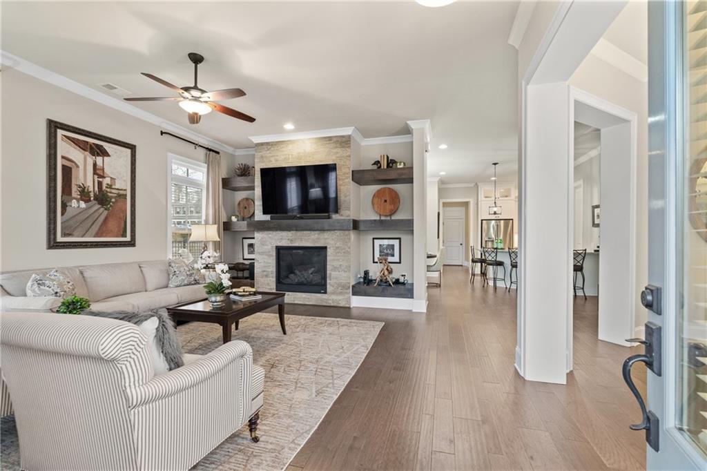98 Academy Street Alpharetta, GA 30009 - Photo 19 of 56 a living room with furniture fireplace and a flat screen tv