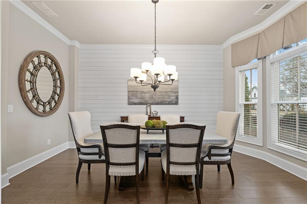 98 Academy Street Alpharetta, GA 30009 - Photo 22 of 56 a view of a dining room with furniture window and wooden floor