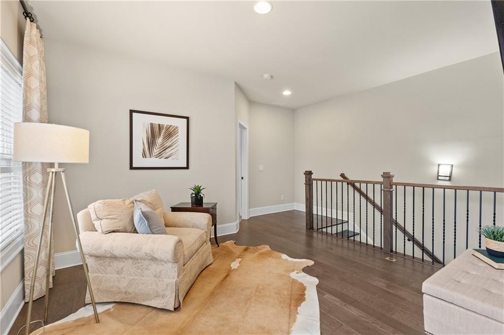 98 Academy Street Alpharetta, GA 30009 - Photo 26 of 56 a living room with furniture and a wooden floor