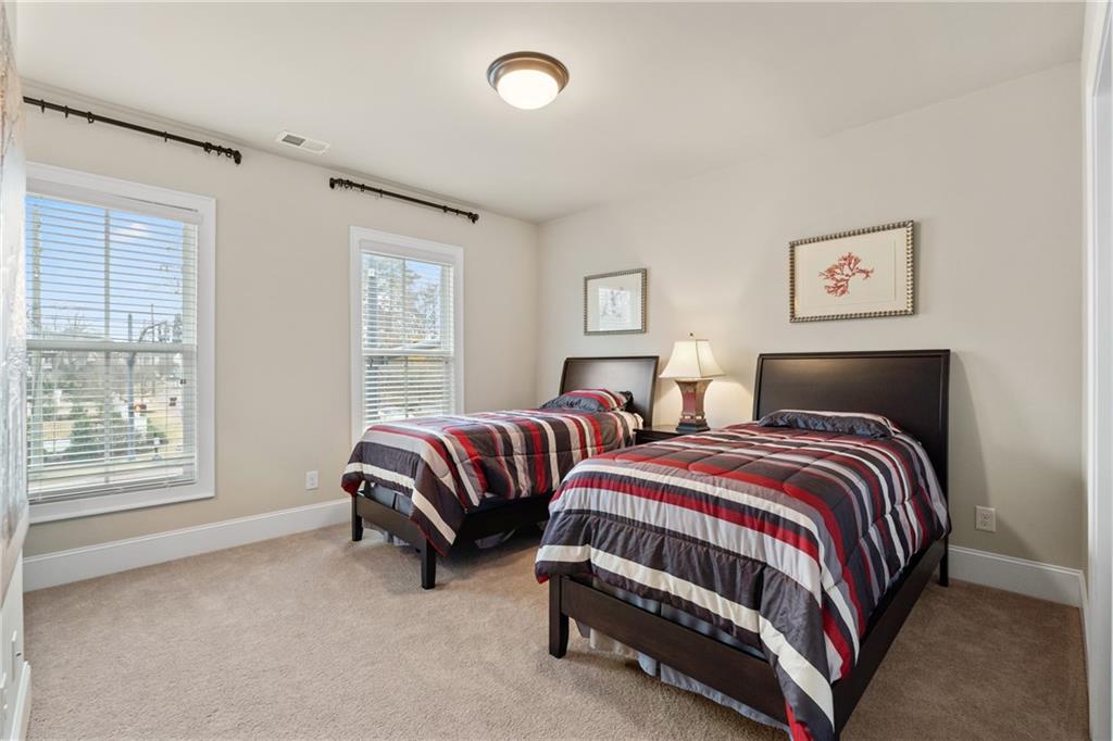 98 Academy Street Alpharetta, GA 30009 - Photo 33 of 56 a bedroom with two beds and a window