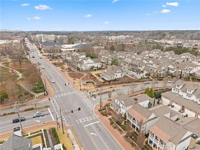 an aerial view of a city with ocean view
